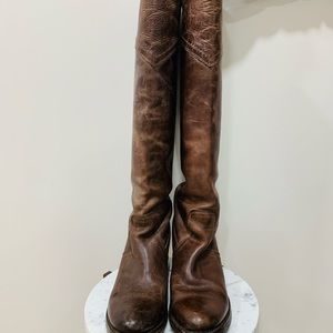 Frye over-the-knee distressed leather boots.
